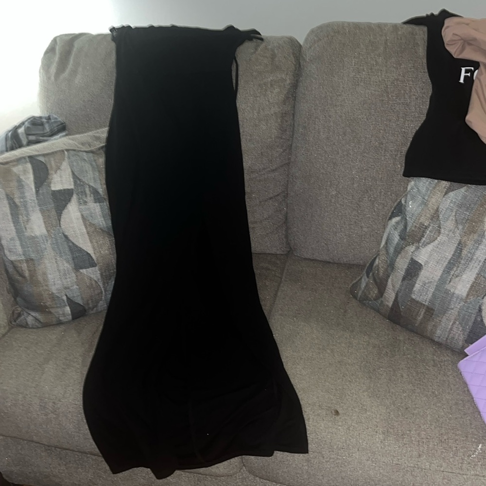 I am saling a black dress with split brand new never been worn